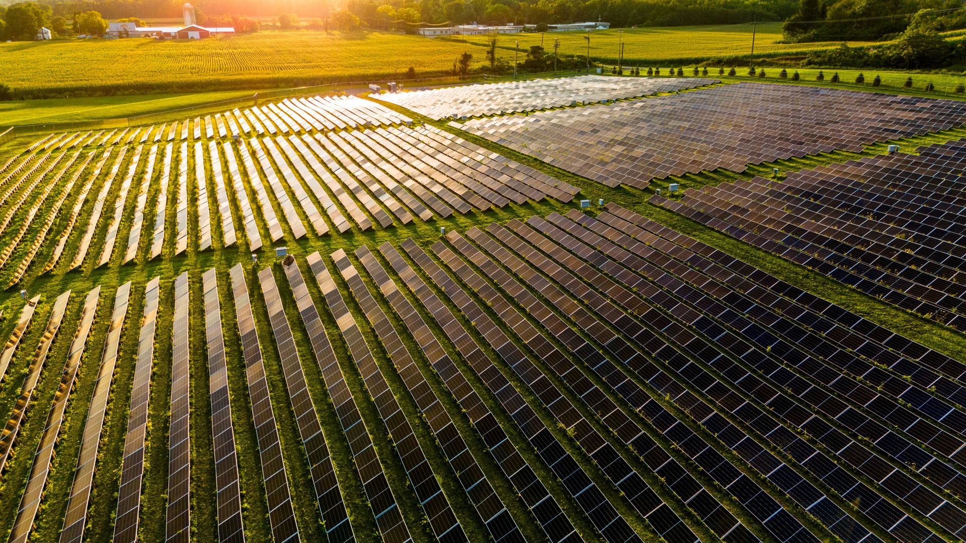 Revolutionizing sun energy in local community in Pennsylvania at sunset. Vast solar farm transforms Brodheadsville farmlands